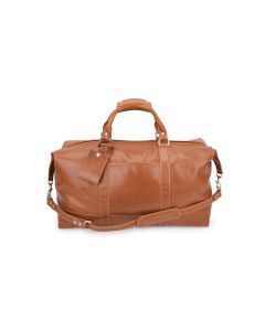 Front view of this captain's bag. It features British tan Florentine leather. It has a strap attached and a luggage tag. The luggage tag has initials placed on it.